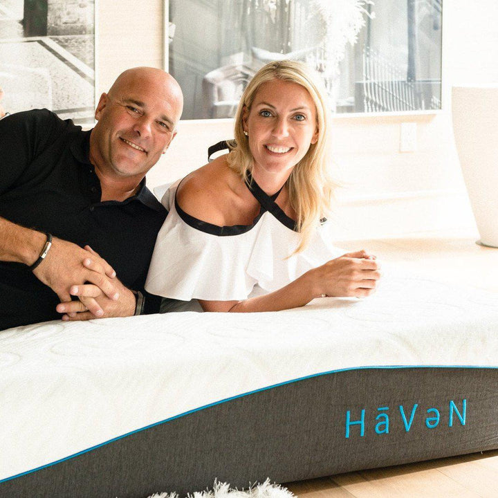 bryan and sarah baeumler laying on a haven mattress