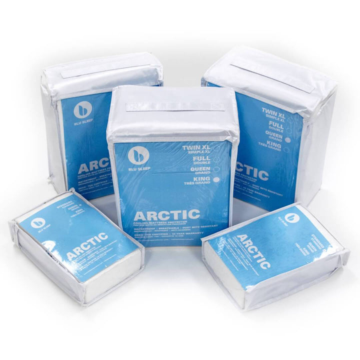 Three Artic Cooling Bedface mattress protectors including two Artic Cooling pillow protectors in plastic and blue zip up packaging with handles that say 'Blu Sleep' with logo in various bed sizes to be used on twin, queen, or king mattresses