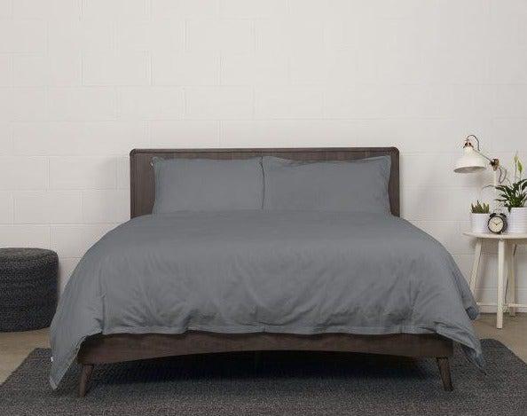 showcase of Bedface 100% Cotton Percale European bundle collection with Sheet set and Duvet cover in Storm Grey on a Haven mattress Bed-in-box on a dark brown bed frame