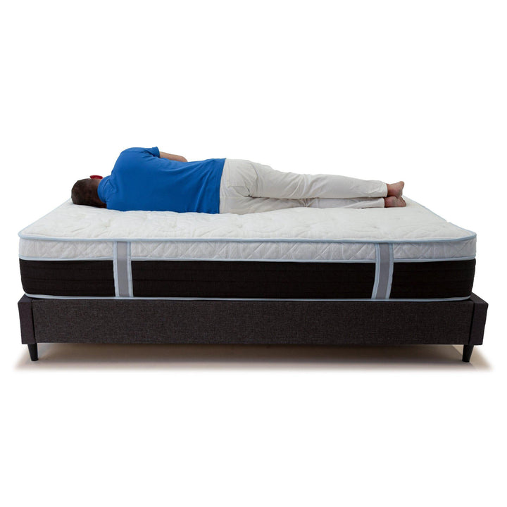 person laying across Haven 12" Hybrid Eurotop mattress showcasing how the mattress forms to body while laying on side