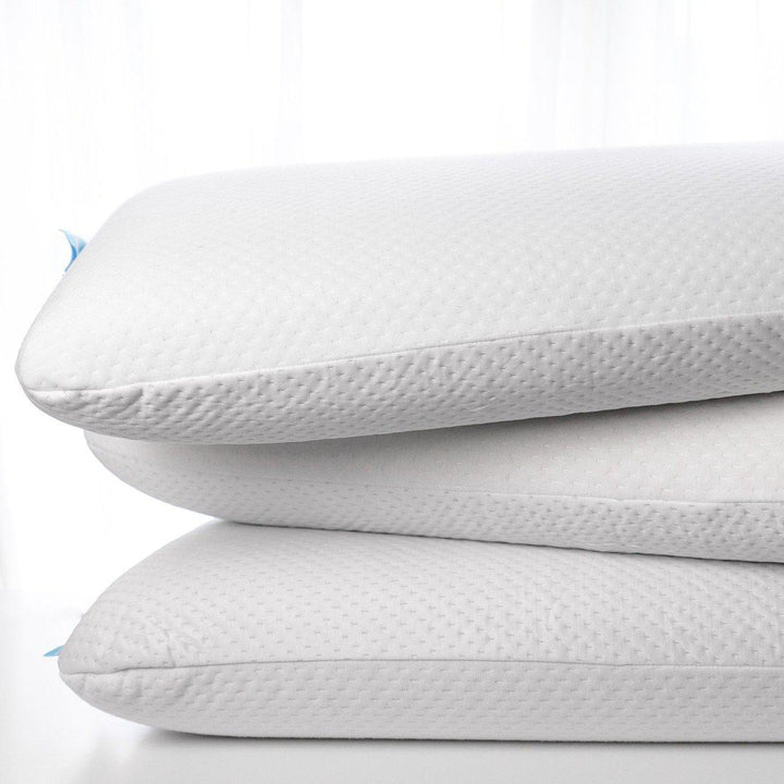 VitaGel 4-in-1 memory foam pillow using plant based materials stacked up in a pile of 3