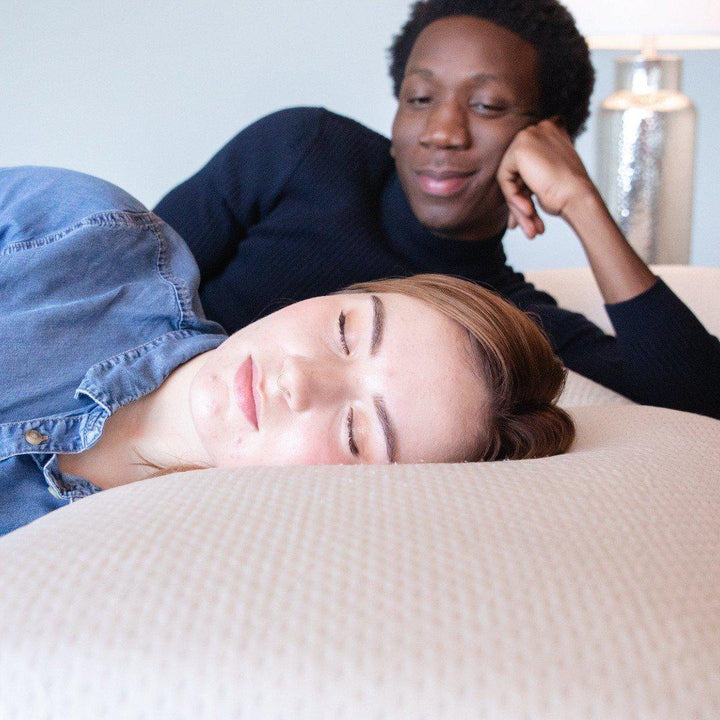 Woman and man laying on Vita Gel 4-1 pillow sold by Haven Sleep Co