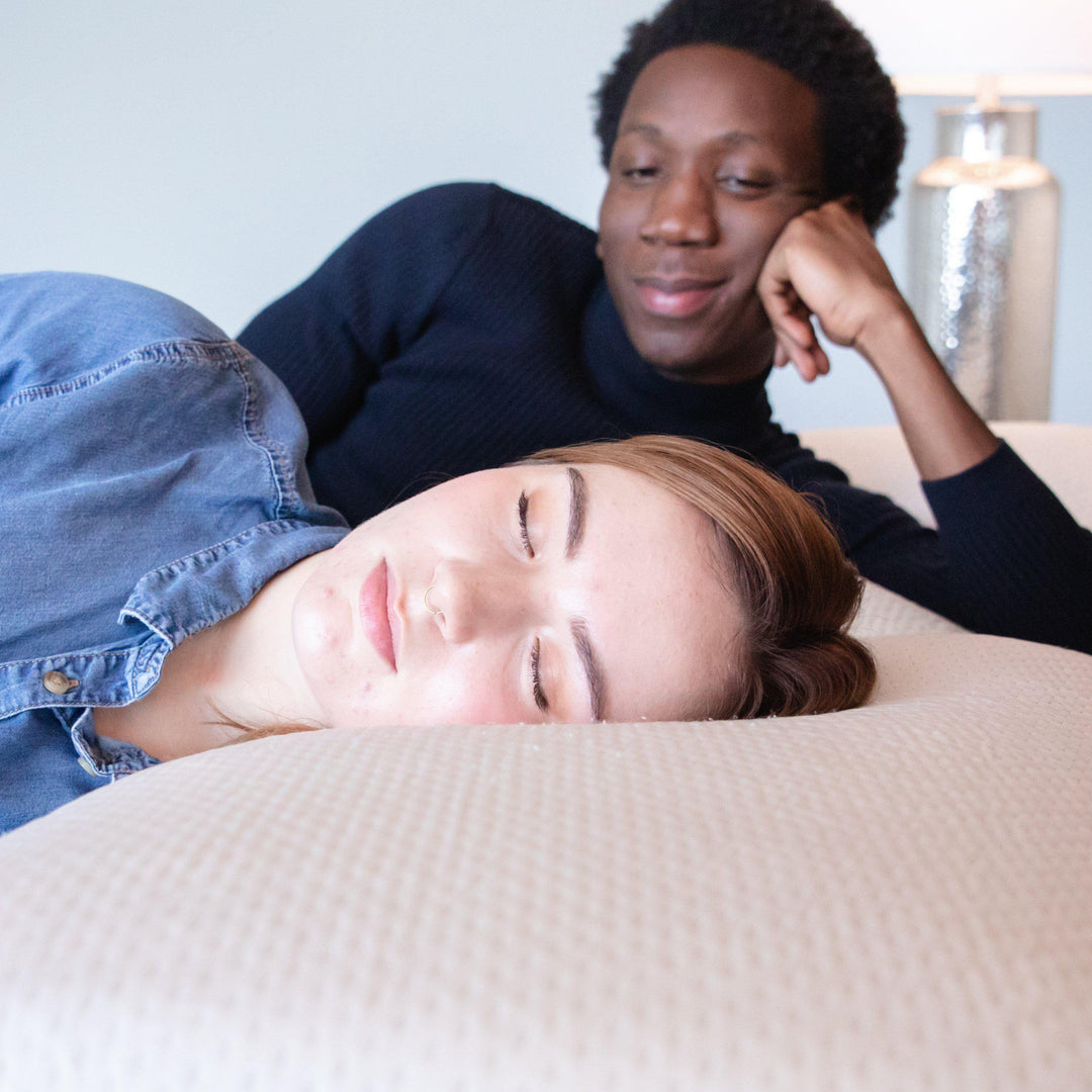 man staring lovingly at woman as she sleeps on a Bedface VitaGel 4 in 1 pillow on a Haven Mattress