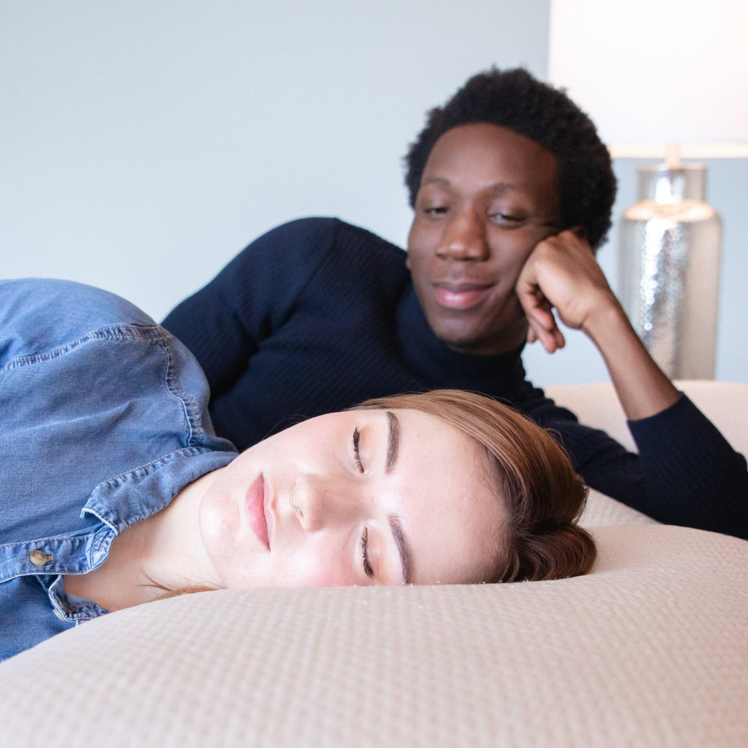 man staring lovingly at woman as she sleeps on a Bedface VitaGel 4 in 1 pillow on a Haven Mattress
