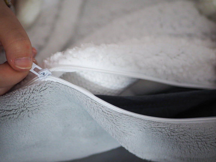 close up of removable fleece cover showing the inside layer of the Hush Vegan Weighted throw blanket