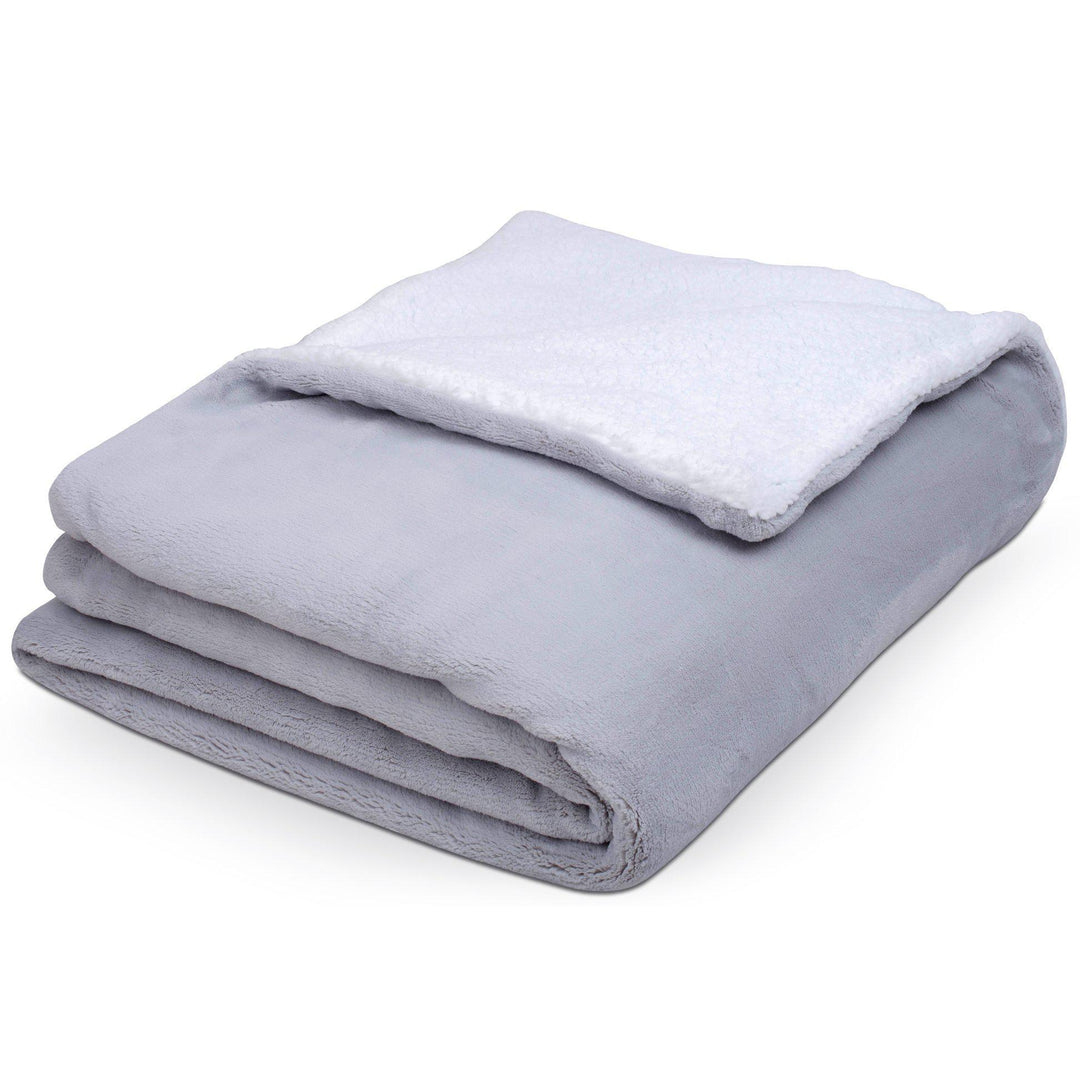 Folded up Hush Weighted warming blanket in grey with fussy inside layer folded out on top