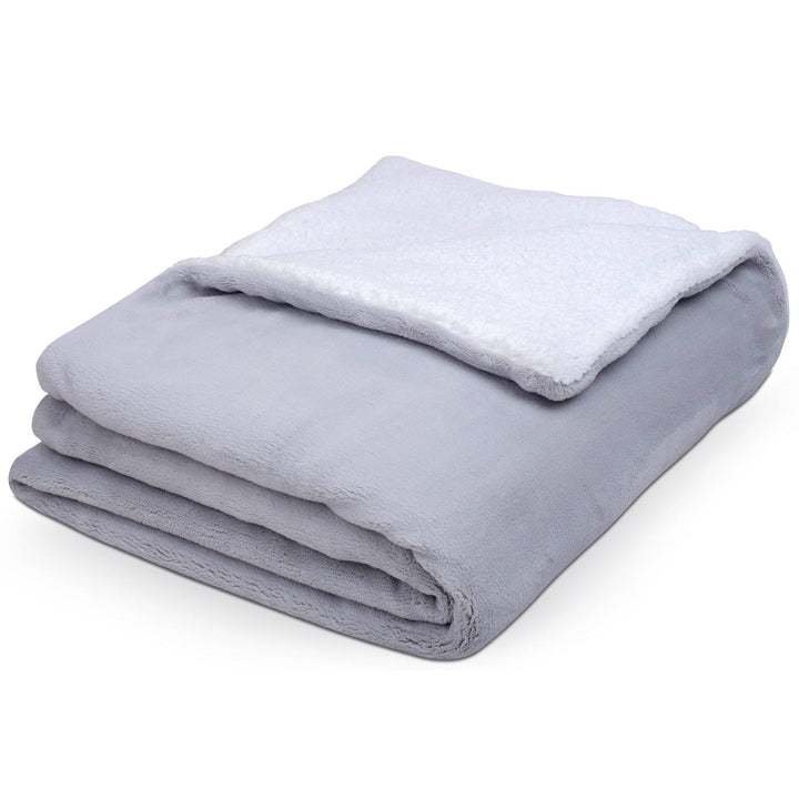 Folded up Hush Weighted warming blanket in grey with fussy inside layer folded out on top